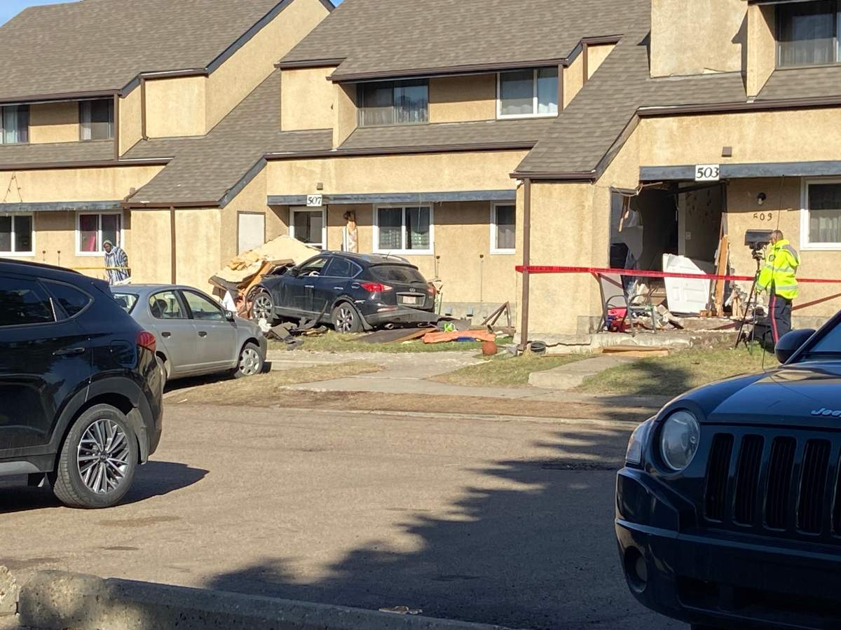 Police in Edmonton are investigating what caused an SUV to crash into a townhouse complex Sunday morning.