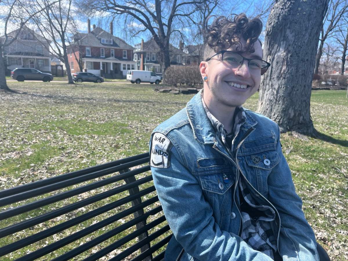 Izzy Gallant sits on a bench