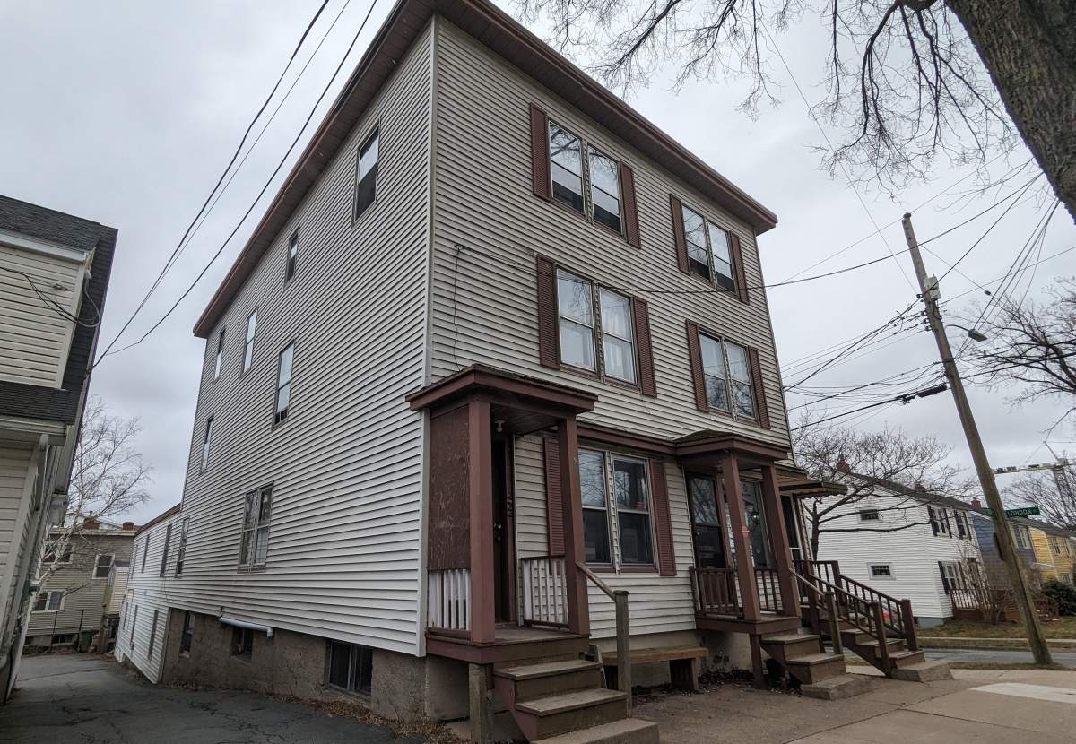 Sarah Mosher rents a small one-bedroom apartment in this Oxford Street building for $910. In September, the rent is going up to at least $1,300.
