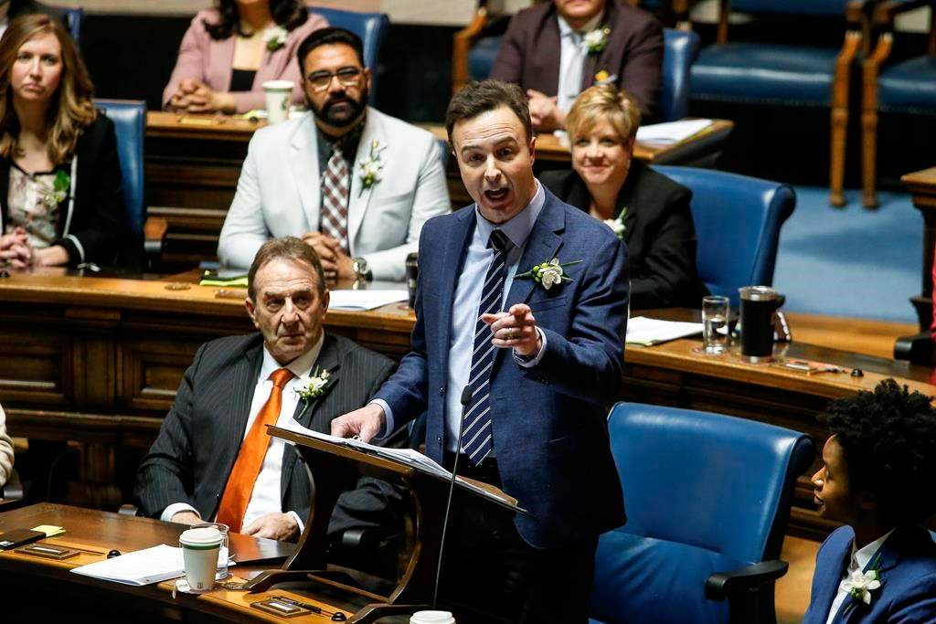 Manitoba Finance Minister Adrien Sala delivers the provincial budget in the Manitoba legislature in Winnipeg, Tuesday, April 2, 2024.  THE CANADIAN PRESS/John Woods.