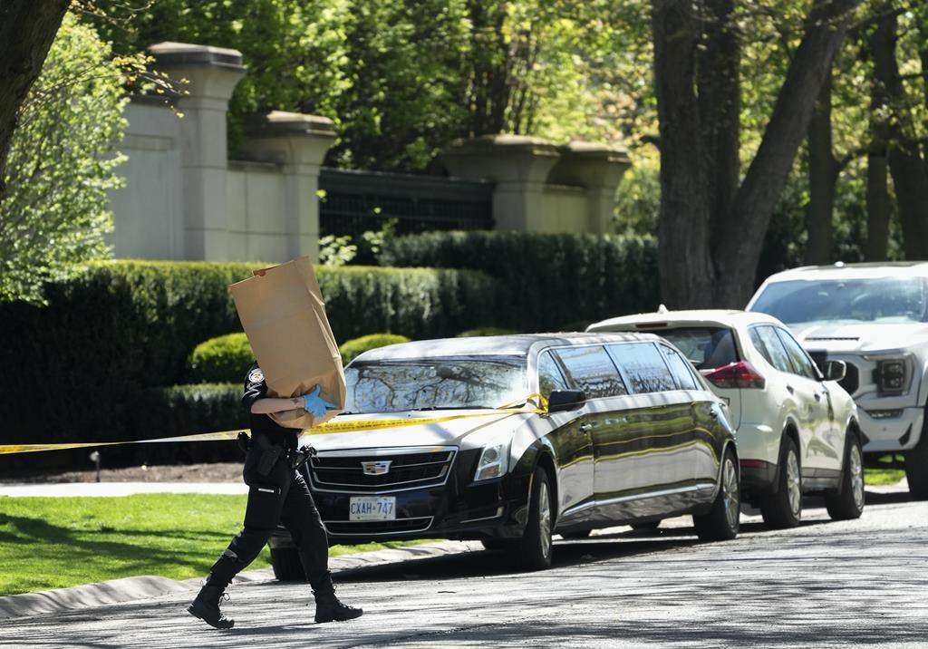 Toronto police are seeking help from the public as they continue to investigate a shooting that seriously injured a security guard outside rapper Drake’s mansion. Toronto Police investigate a crime scene outside the mansion of Canadian rap mogul Drake in Toronto’s Bridle Path neighbourhood, Tuesday, May 7, 2024.