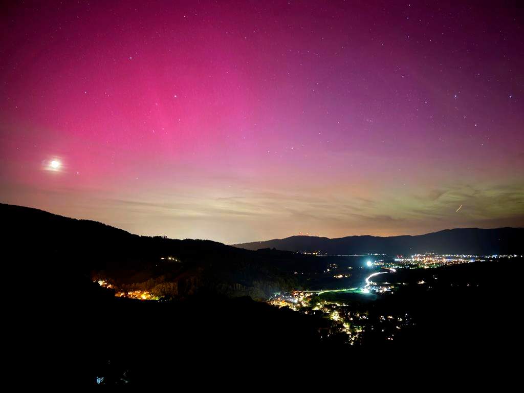 Northern lights appear over the Dreisamtal valley in the Black Forest near Freiburg, Germany, Friday evening, May 10, 2024.