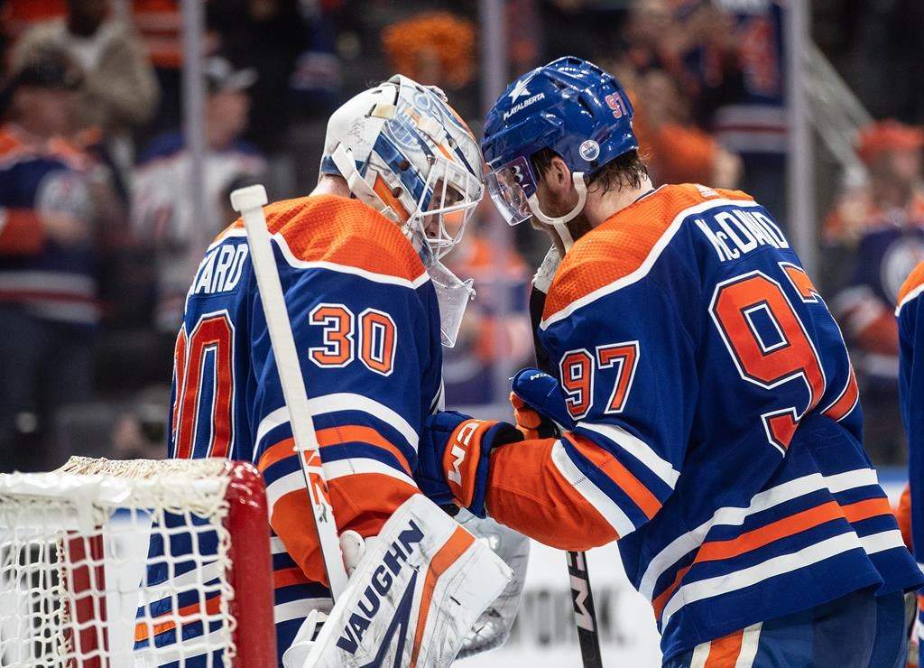 Edmonton Oilers goalie Calvin Pickard (30) and Connor McDavid (97) celebrate the win over the Vancouver Canucks during second-round NHL playoff action in Edmonton, Tuesday, May 14, 2024.