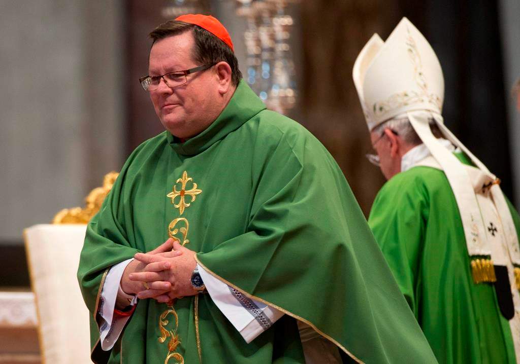 Cardinal Gerald Lacroix, Archbishop of Quebec leaves after he delivering a speech during a mass in St. Peter's Basilica, at the Vatican, Sunday, Oct. 12, 2014. An investigation commissioned by the Vatican has concluded Lacroix did not commit sexual misconduct.THE CANADIAN PRESS/AP/Andrew Medichini.