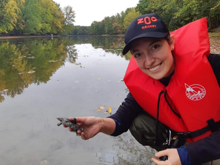 A Zoo de Granby expert with a spiny softshell turtle.