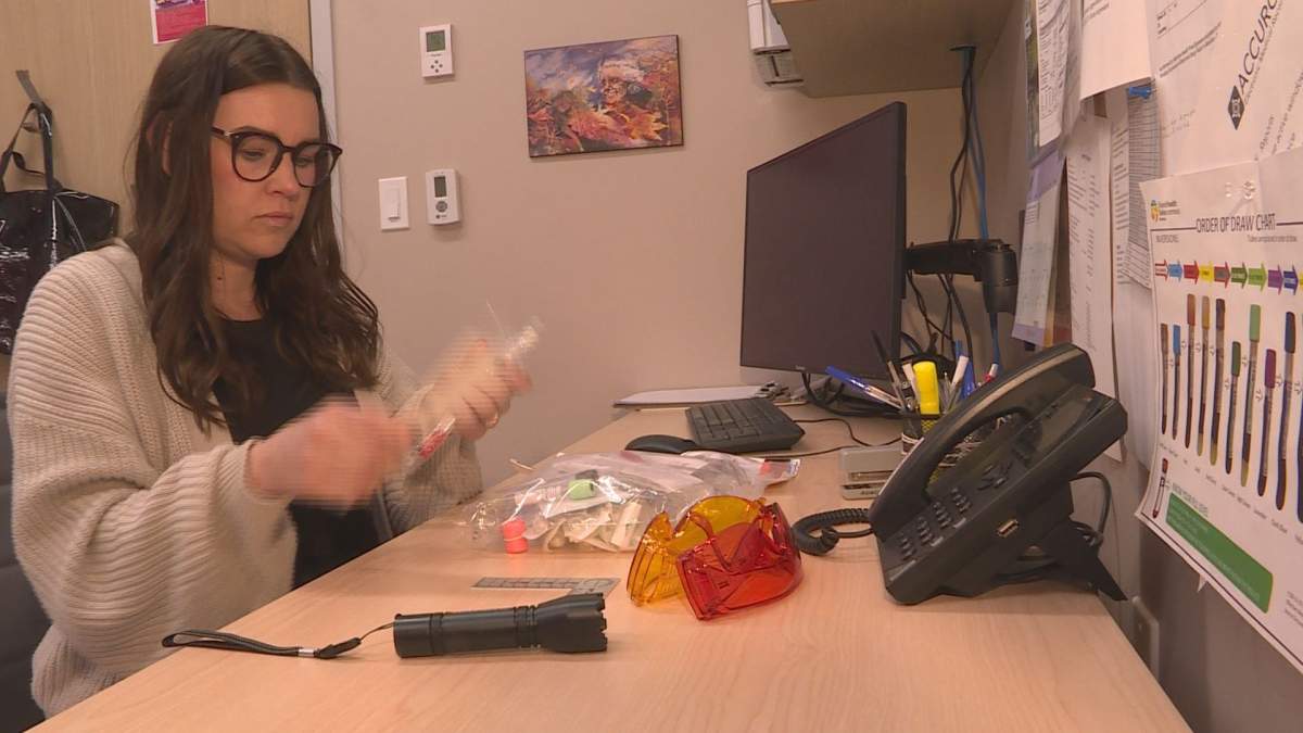 Ashley Stewart, the medical services coordinator of the Hummingbird program at Klinic Community Health, lays out a sexual assault forensic testing kit.