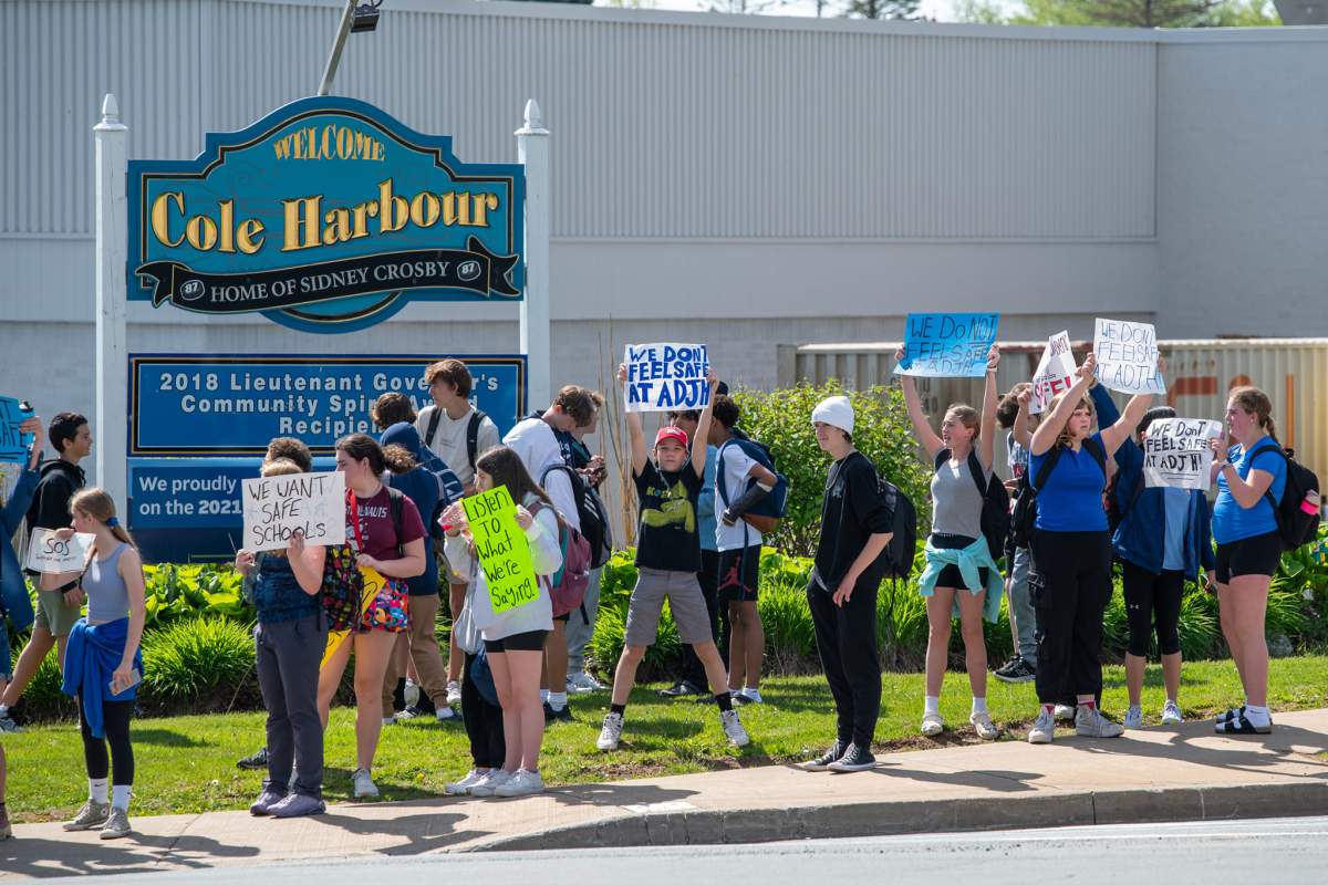 Students take to the street after walking out from classes midday on Friday.