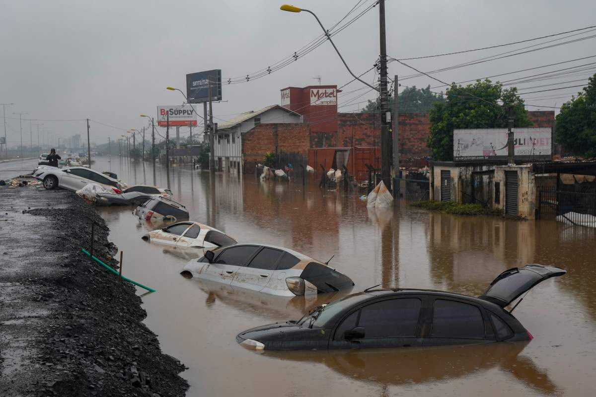 Vehicles are partially submerged on a street flooded by heavy rains in Sao Leopoldo, Rio Grande do Sul state, Brazil