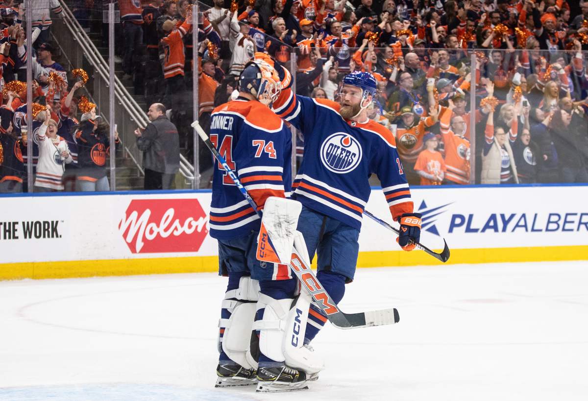 Edmonton Oilers goalie Stuart Skinner (74) and Mattias Ekholm (14) celebrate the win over the Los Angeles Kings during NHL playoff action in Edmonton on Wednesday May 1, 2024.