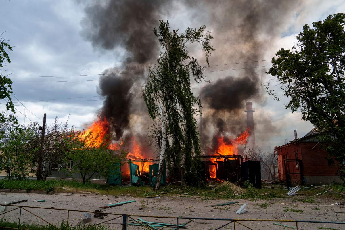 Residential houses on fire after Russian airstrikes in Vovchansk, Ukraine, on Saturday, May 11, 2024.