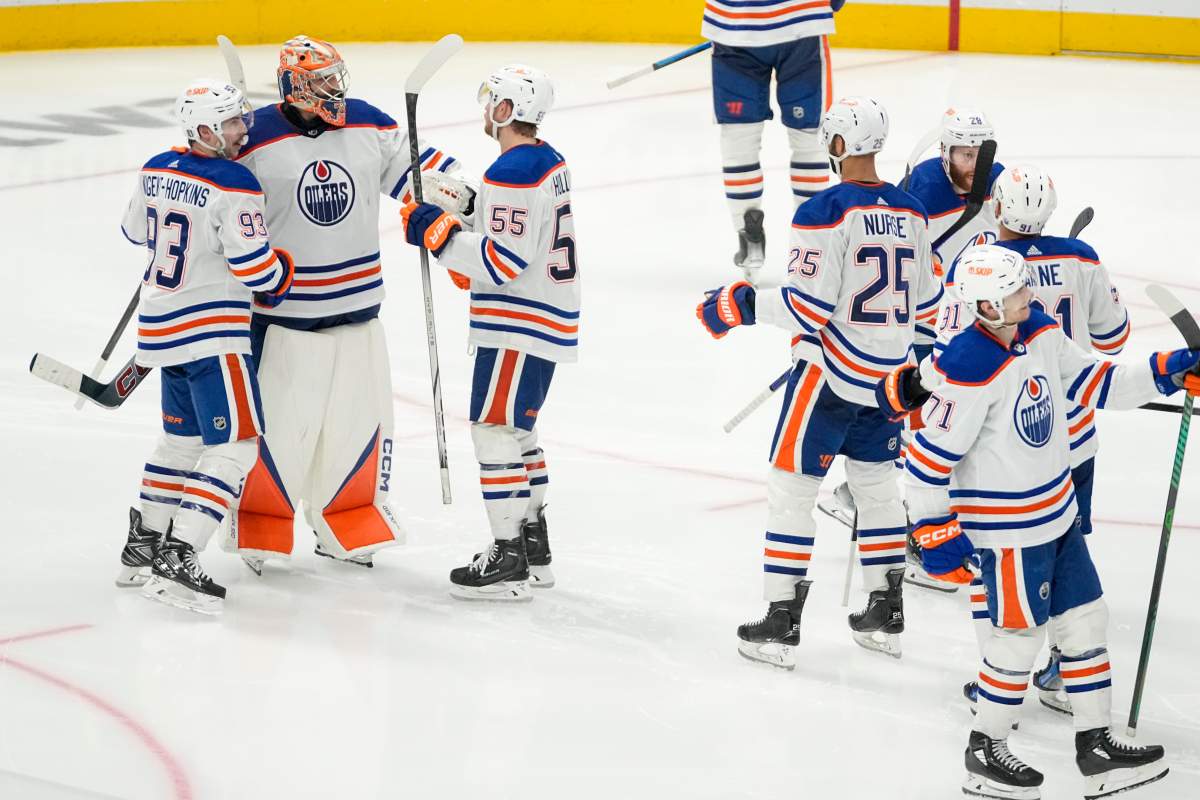 Edmonton Oilers goaltender Stuart Skinner, second from left, celebrates with teammates after they beat the Dallas Stars 3-2 in double overtime in Game 1 of the NHL hockey Western Conference Stanley Cup playoff finals, Thursday, May 23, 2024, in Dallas.