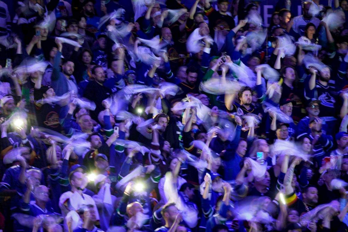 Fans wave towels before the Vancouver Canucks and Edmonton Oilers play Game 7 of an NHL hockey Stanley Cup second-round playoff series, in Vancouver, on Monday, May 20, 2024.