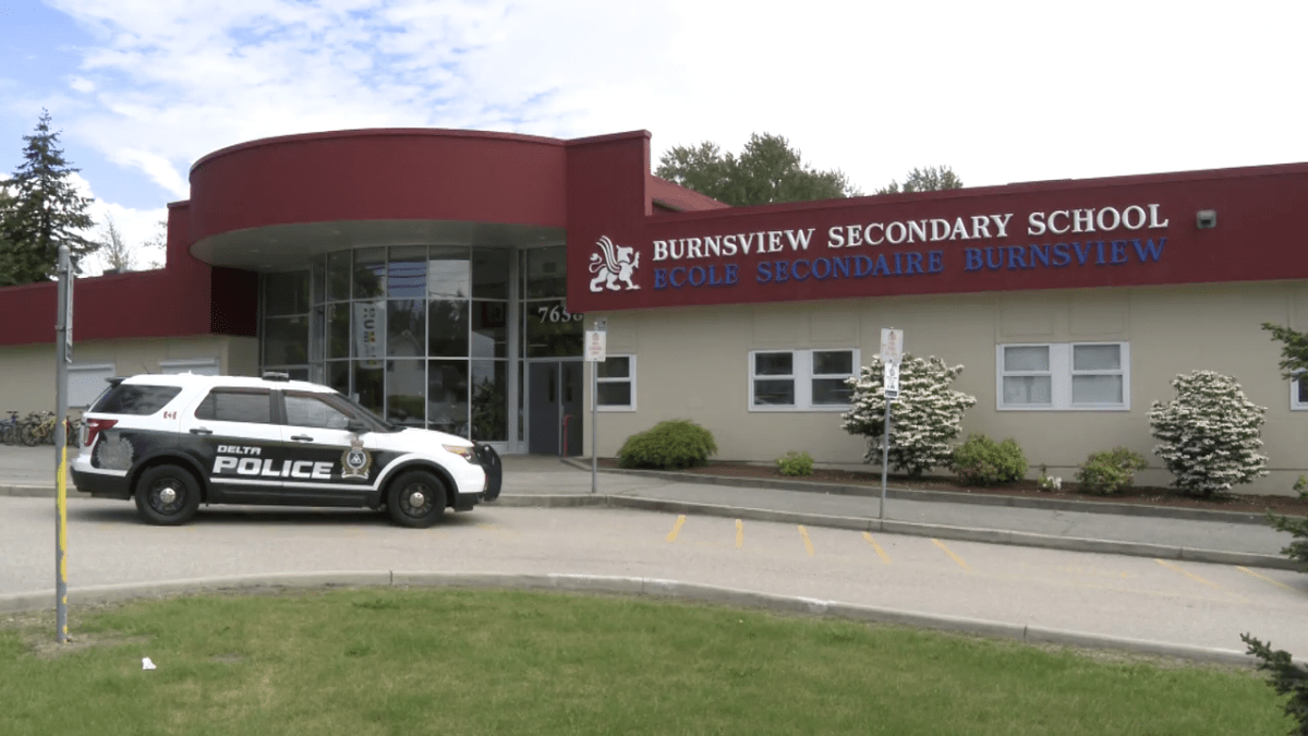 Delta police outside Burnsview Secondary following a fake call about someone with a gun on campus. 