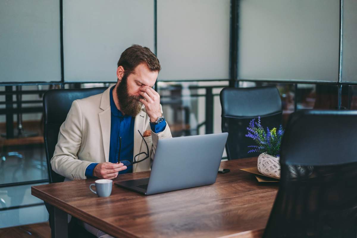 Stressed businessman finding out he has been Fired after returning from a vacation