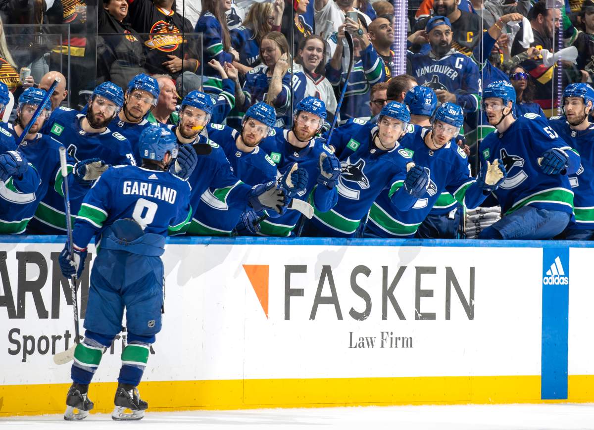 Conor Garland #8 of the Vancouver Canucks celebrates his goal with teammates during the third period in Game Seven of the Second Round of the 2024 Stanley Cup Playoffs at Rogers Arena on May 20, 2024 in Vancouver, British Columbia, Canada.