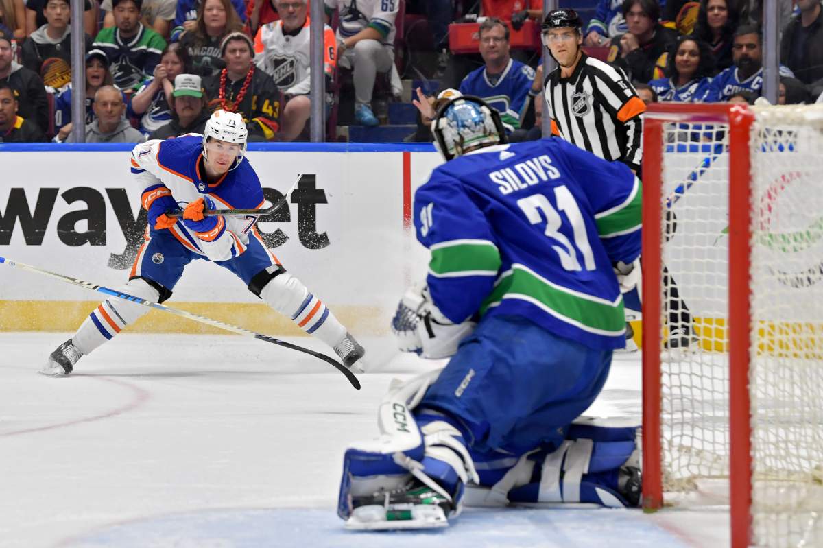 Arturs Silovs #31 of the Vancouver Canucks saves a shot attempt by Ryan McLeod #71 of the Edmonton Oilers during the first period in Game Seven of the Second Round of the 2024 Stanley Cup Playoffs at Rogers Arena on May 20, 2024 in Vancouver, British Columbia.