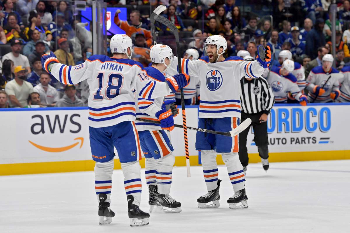 Evan Bouchard #2 of the Edmonton Oilers celebrates with teammates after his goal during the second period in Game Seven of the Second Round of the 2024 Stanley Cup Playoffs at Rogers Arena on May 20, 2024 in Vancouver, British Columbia.