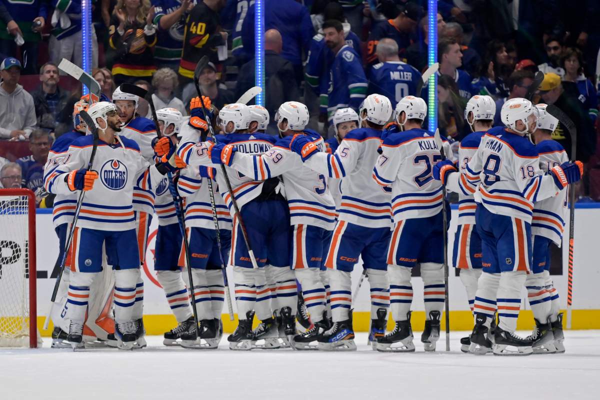 The Edmonton Oilers celebrate after winning Game Seven of the Second Round of the 2024 Stanley Cup Playoffs at Rogers Arena on May 20, 2024 in Vancouver, British Columbia.