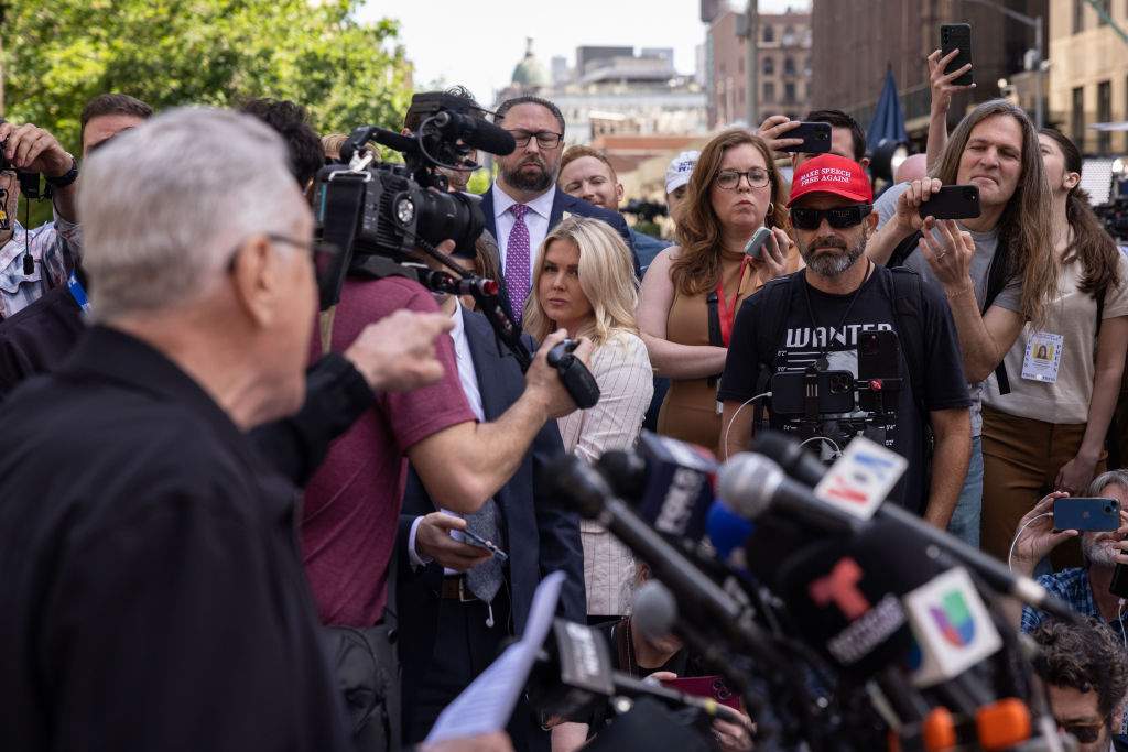 Actor Robert De Niro, left, points to a supporter of former US President Donald Trump during a news conference outside Manhattan criminal court in New York, US, on Tuesday, May 28, 2024. Former US President Donald Trump faces 34 felony counts of falsifying business records as part of an alleged scheme to silence claims of extramarital sexual encounters during his 2016 presidential campaign.