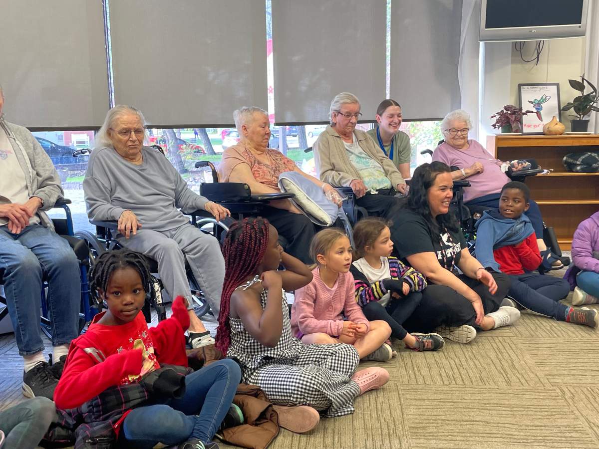 Students from Father Leo Green Catholic Elementary School with residents of St. Michael’s Long Term Care Centre in north Edmonton.