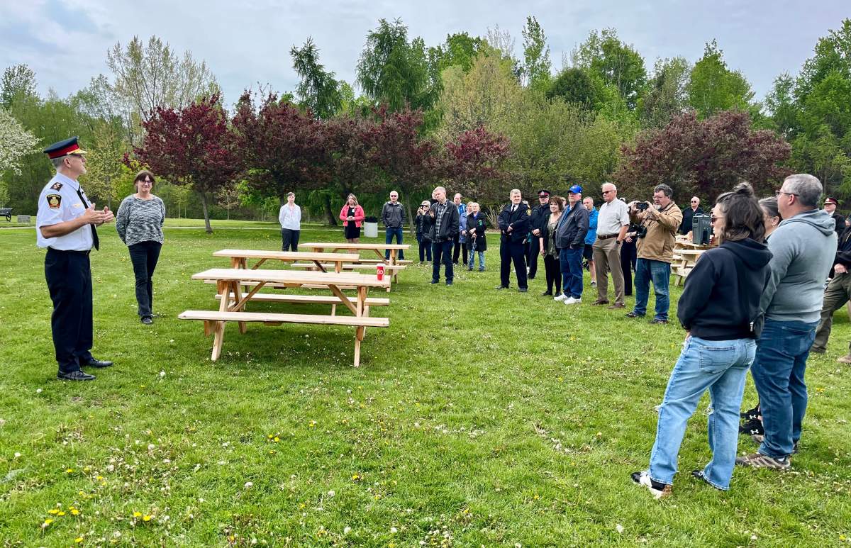 Cobourg Police Service Chief Paul VandeGraaf speaks to the audience during a ceremony to mark the 20th anniversary of the murder of Const. Chris Garrett at the park named in his honour on May 15, 2024.