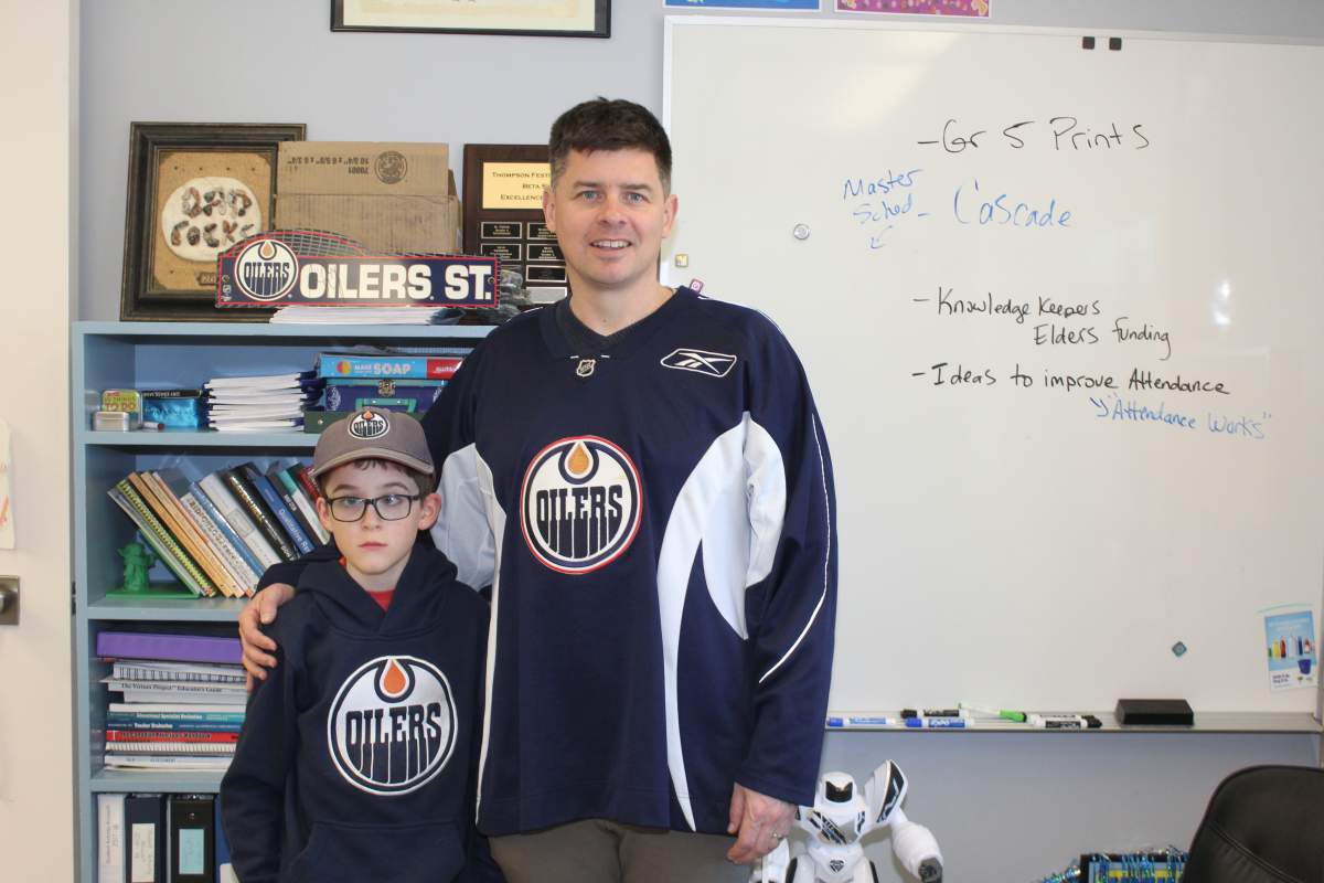 Levi Ford, 9, and his school principal Mr. Harwood have bonded over their love of the Edmonton Oilers.