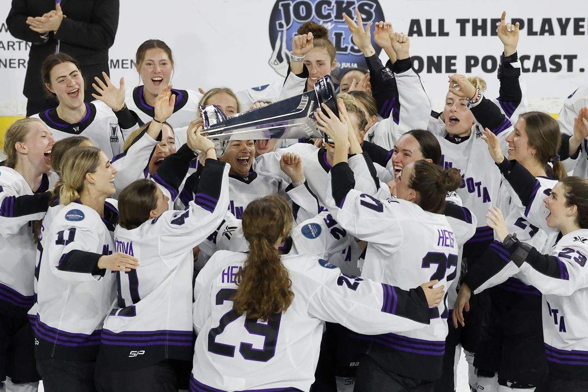 Minnesota players celebrate with the Walter Cup after defeating Boston to win the PWHL Walter Cup, Wednesday May 29, 2024, in Lowell, Mass.
