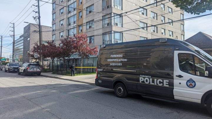 Toronto police at the scene of a fatal shooting in the Eglinton Avenue West and Northcliffe Boulevard area.