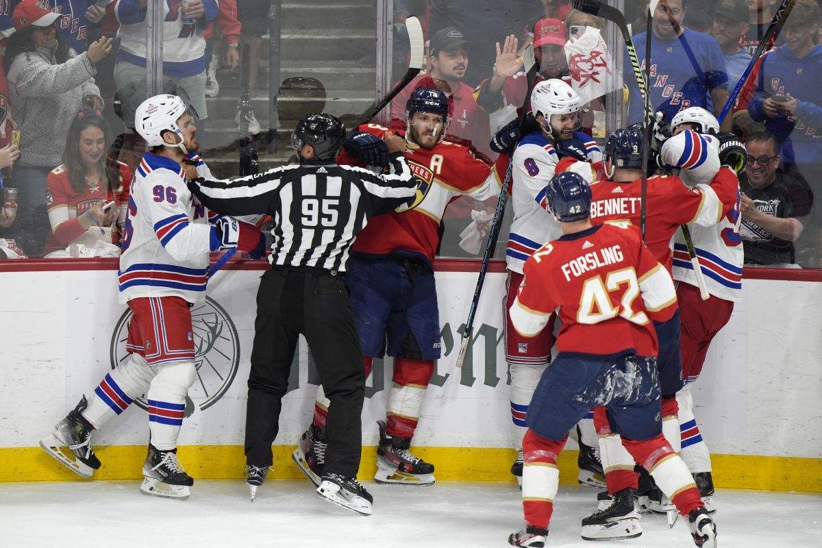 Players scuffle during the first period of Game 4 during the Eastern Conference finals of the NHL hockey Stanley Cup playoffs between the Florida Panthers and the New York Rangers, Tuesday, May 28, 2024, in Sunrise, Fla.
