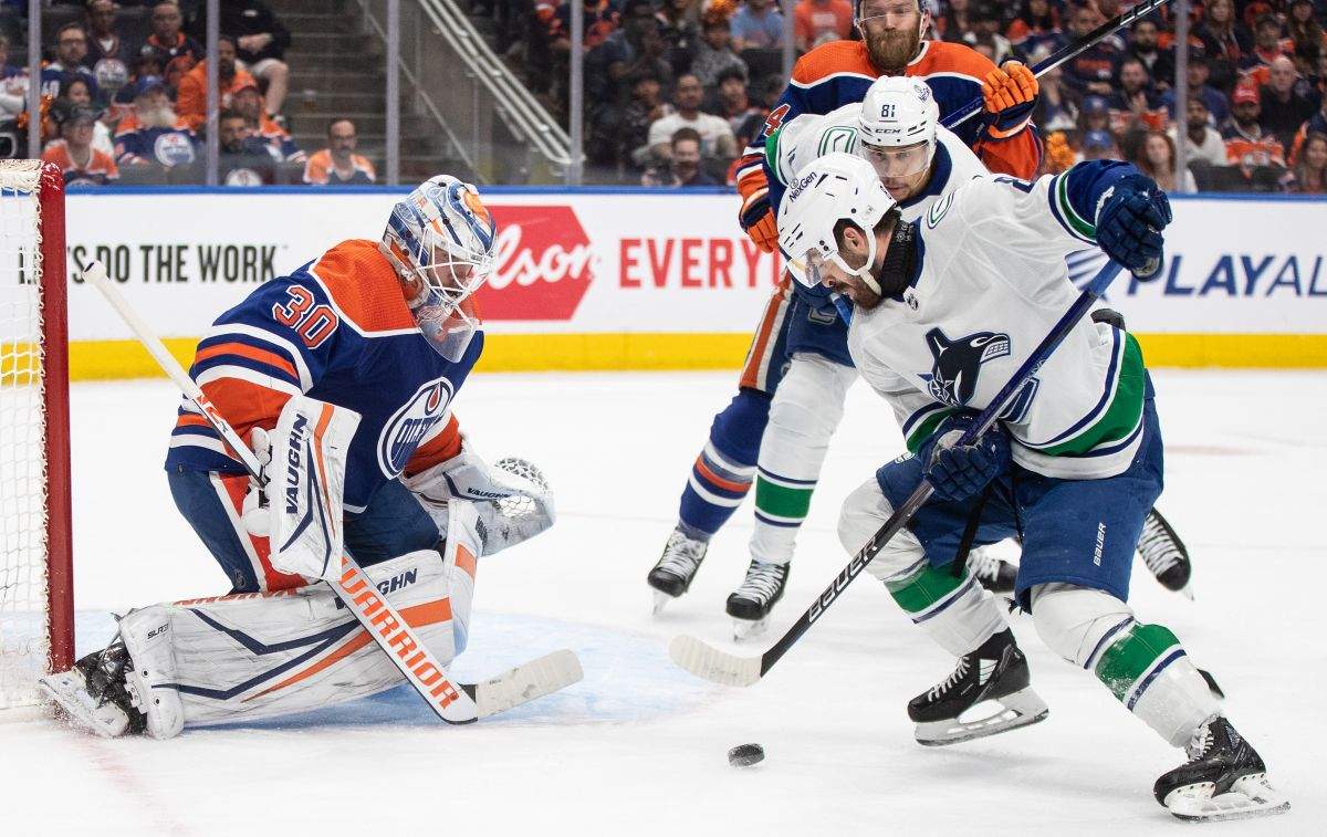 Vancouver Canucks' Conor Garland (8) is stopped by Edmonton Oilers goalie Calvin Pickard (30) during first period second-round NHL playoff action in Edmonton on Tuesday May 14, 2024.