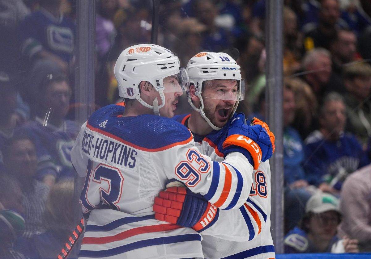 Edmonton Oilers' Ryan Nugent-Hopkins, left, and Zach Hyman celebrate Nugent-Hopkins's goal against the Vancouver Canucks during the second period in Game 7 of an NHL hockey Stanley Cup second-round playoff series, in Vancouver, on Monday, May 20, 2024.