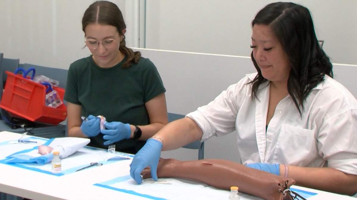 Thompson Rivers University nurse practitioner students practice suturing.