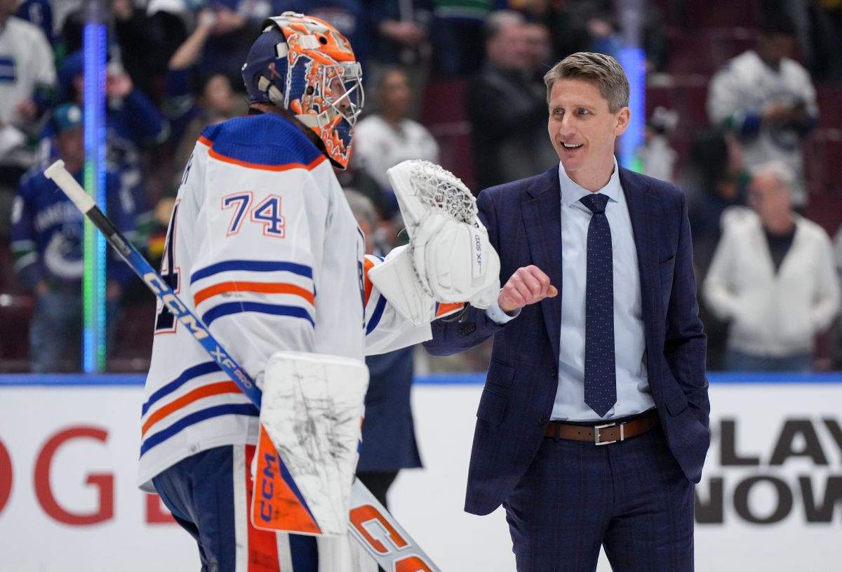 Edmonton Oilers head coach Kris Knoblauch, back right, and goalie Stuart Skinner celebrate after Edmonton defeated the Vancouver Canucks 3-2 during Game 7 of an NHL hockey Stanley Cup second-round playoff series, in Vancouver, on Monday, May 20, 2024.