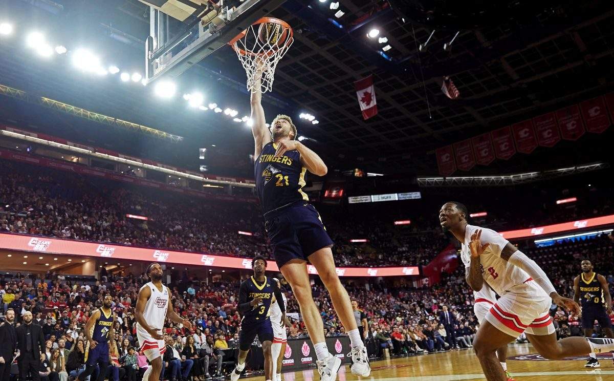 Edmonton Stingers' Ben Krikke (21) dunks against the Calgary Surge during CEBL basketball action in Calgary in this Tuesday, May 21, 2024 handout photo.
