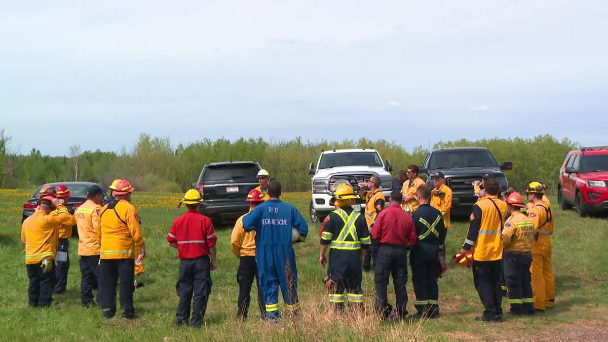 Firefighters from across Canada taking part in a International Association of Fire Fighters urban wildfire training exercise in Strathcona County, Alta. on Tuesday, May 28, 2024.