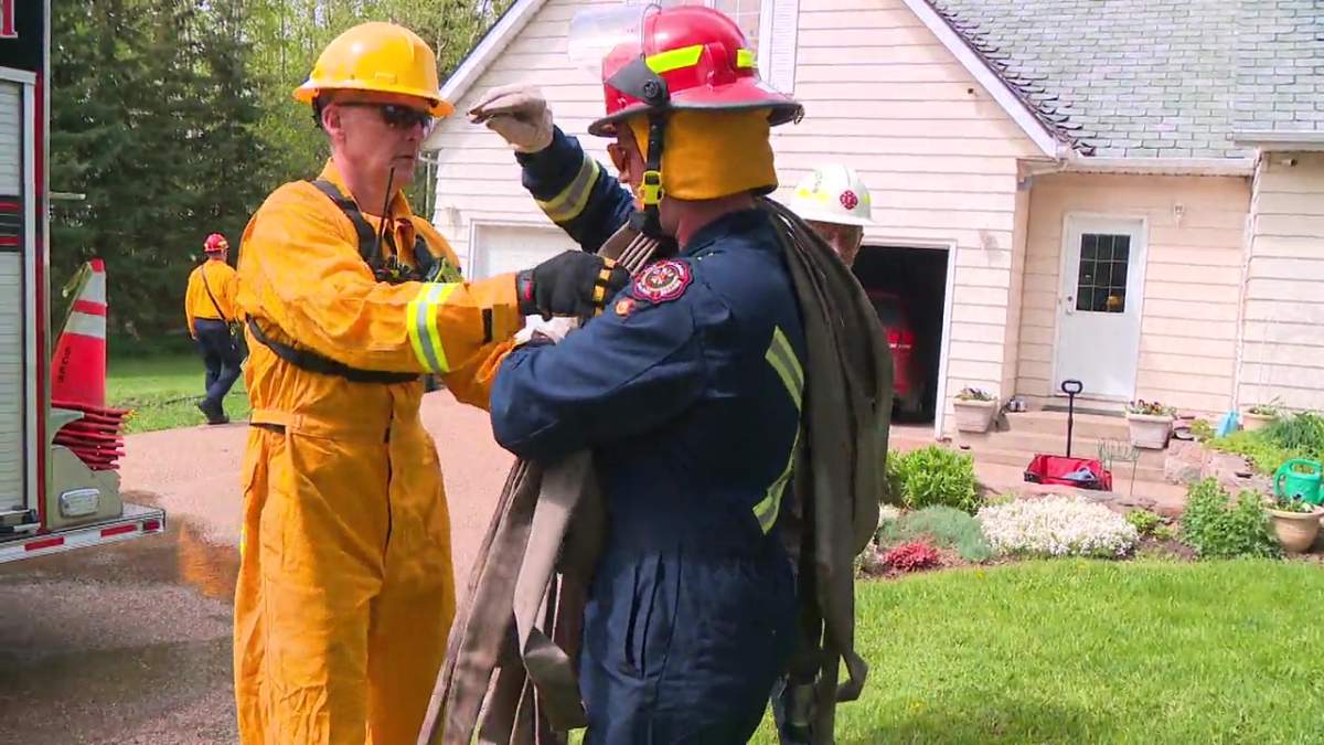 Firefighters from across Canada taking part in a International Association of Fire Fighters urban wildfire training exercise in Strathcona County, Alta. on Tuesday, May 28, 2024.