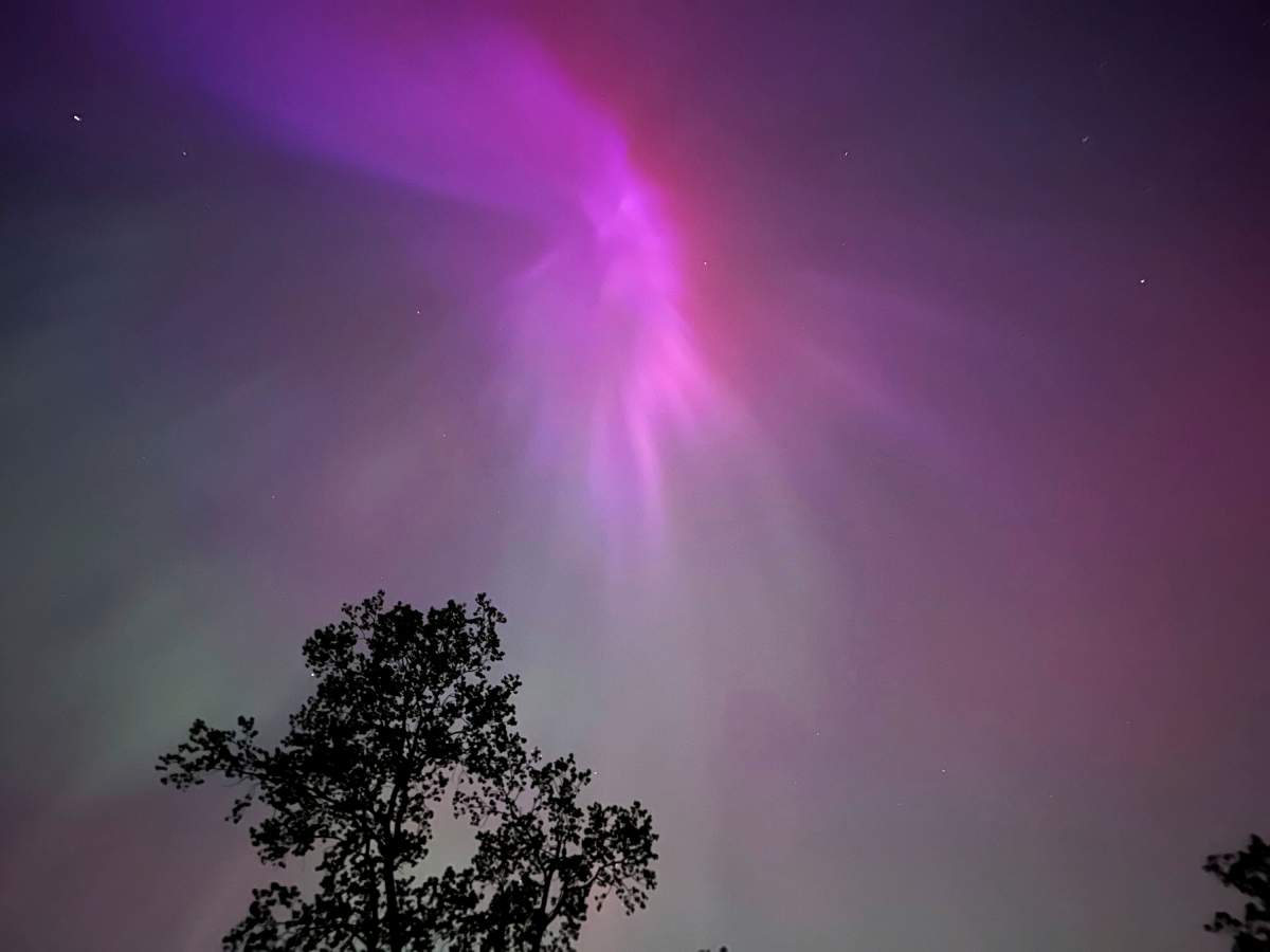 The aurora borealis, also known as the northern lights, is visible over Ann Arbor, Mich., early Saturday, May 11, 2024. (AP Photo/Dee-Ann Durbin)