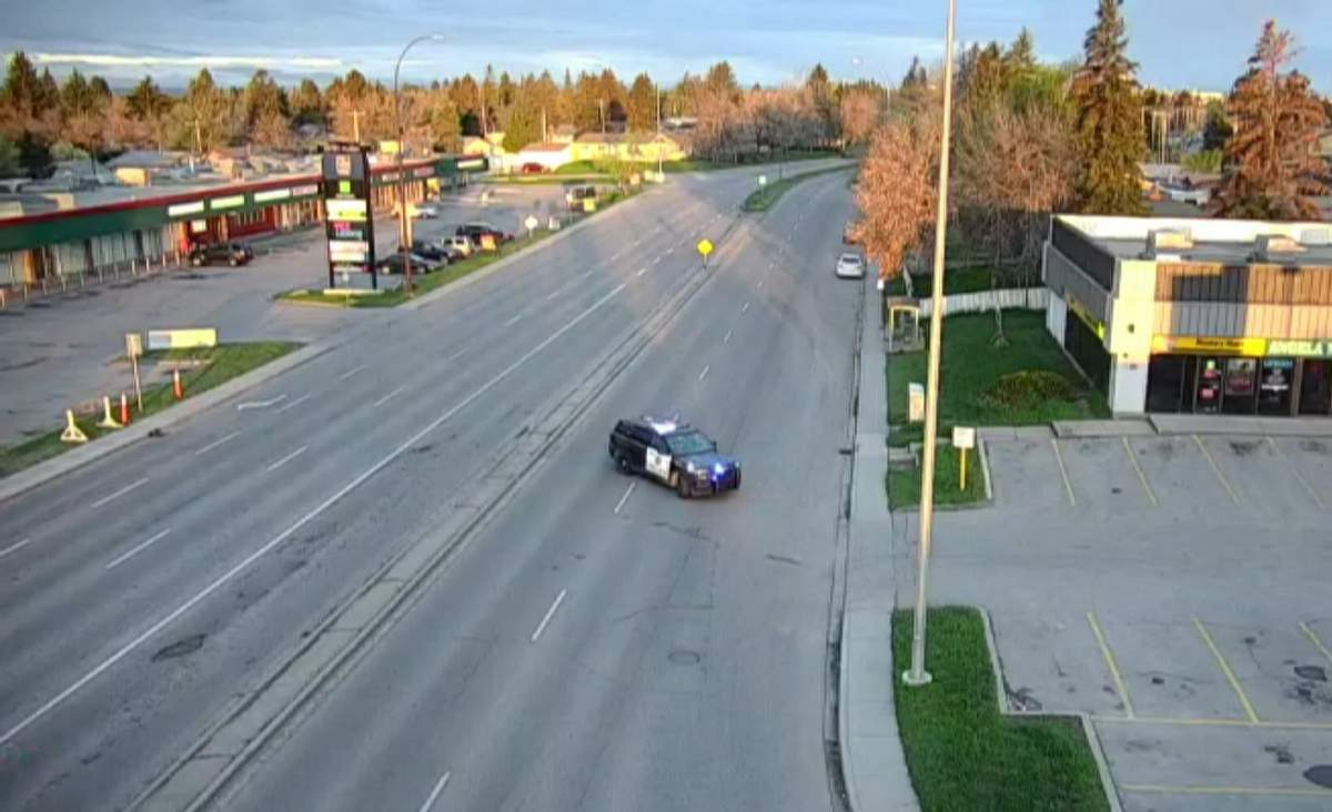 Calgary Police seen here blocking off traffic on Memorial Drive near 47 street S.E. on Saturday May 18, 2024, are asking for the public's help locating the driver of a vehicle they believe may have information about a crash that killed a pedestrian.
