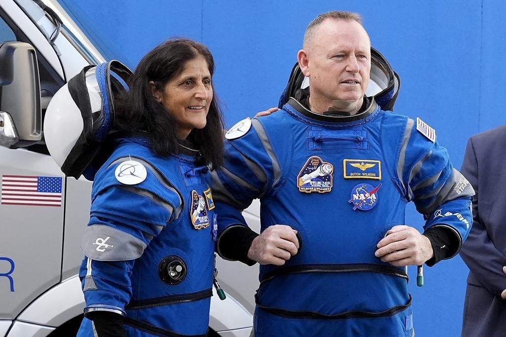 NASA astronauts Suni Williams, left, and Butch Wilmore talk to family members as they leave the operations and checkout building for a trip to launch pad at Space Launch Complex 41 Saturday, June 1, 2024, in Cape Canaveral, Fla.