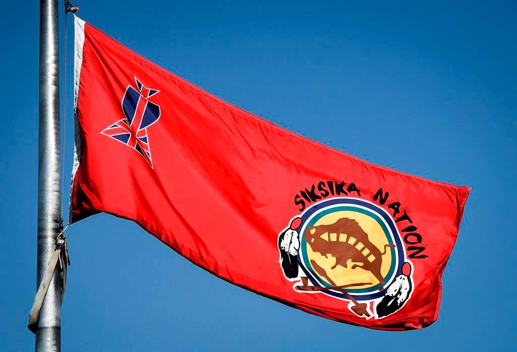 The Siksika Nation flag flies in the breeze on the First Nation, near Cluny, Alta., Thursday, Sept. 28, 2023.