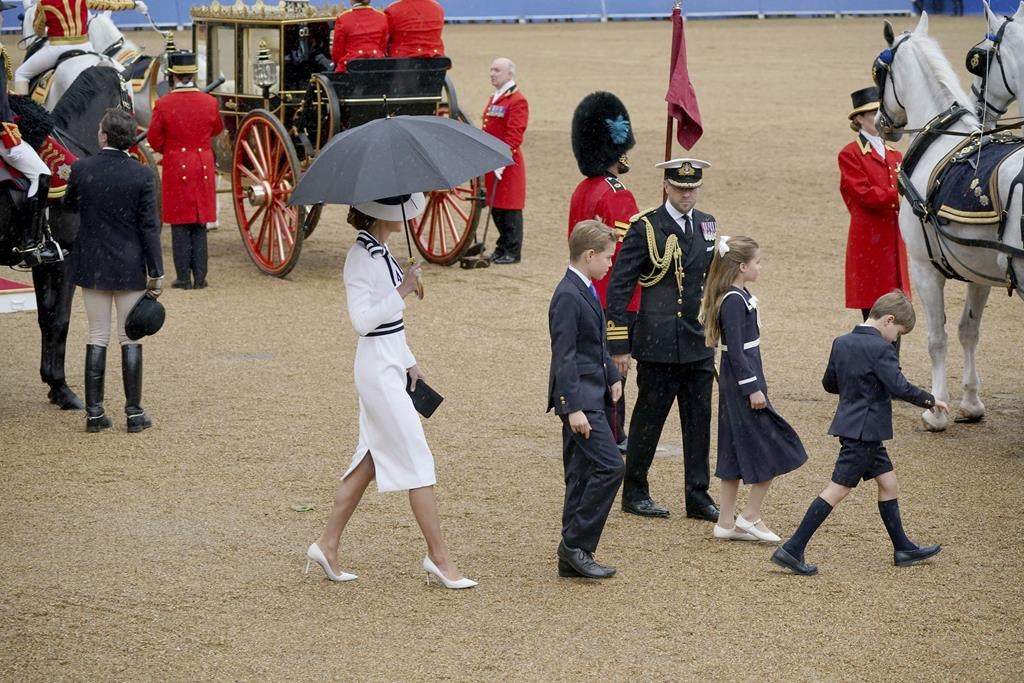 Britain’s Kate, Princess of Wales, Prince Louis, right, Princess Charlotte and Prince George leave Horse Guards Parade after the Trooping the Color ceremony at Horse Guards Parade, London, Saturday, June 15, 2024. Britain is putting on a display of birthday pageantry for King Charles III, a military parade that is the Princess of Wales’ first public appearance since her cancer diagnosis early this year.