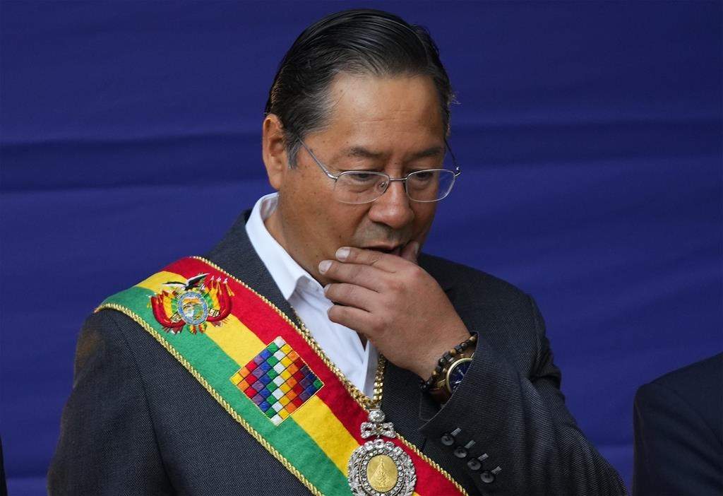 FILE – Bolivian President Luis Arce attends an Indigenous ritual before delivering his annual state of the nation address at the presidential palace in La Paz, Bolivia, Jan. 22, 2024. Armored vehicles rammed into the doors of Bolivia’s government palace Wednesday, June 26, 2024, as a top government official warned of a coup attempt. (AP Photo/Juan Karita, File) (AP Photo/Juan Karita, File)