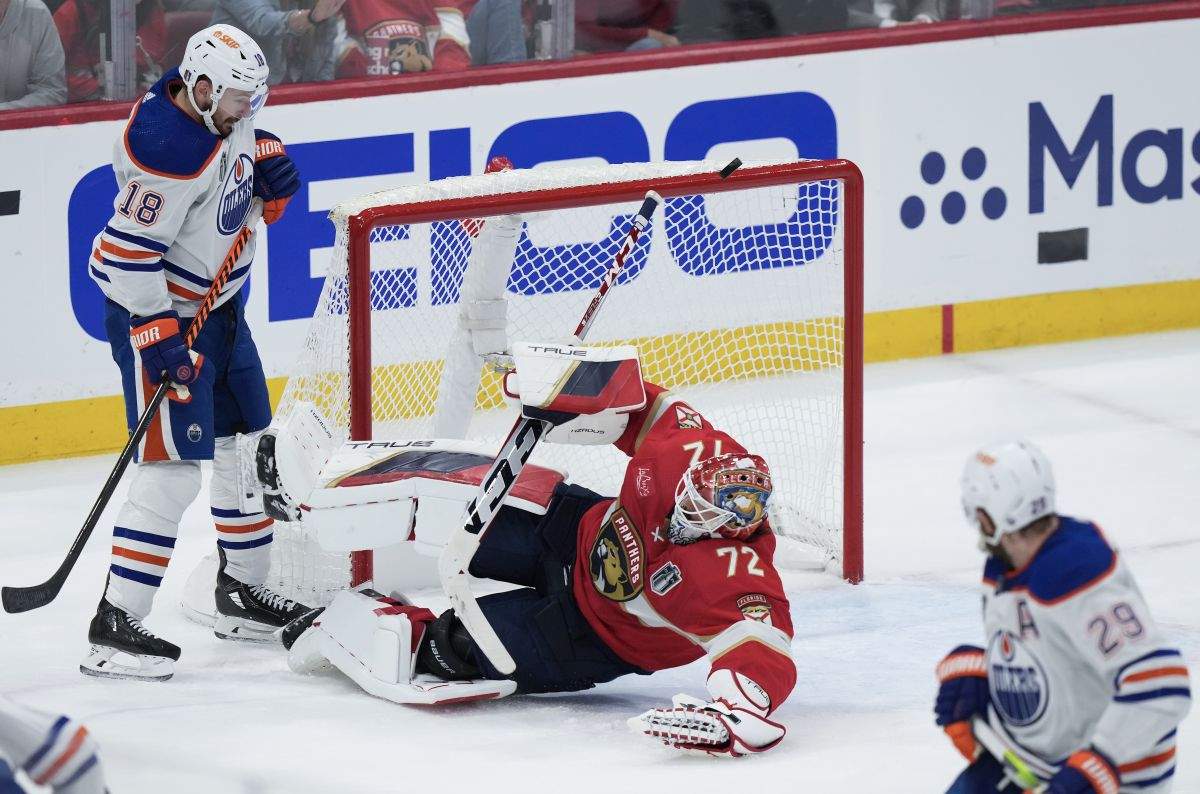 Florida Panthers goaltender Sergei Bobrovsky (72) makes a save as Edmonton Oilers' Zach Hyman (18) looks on during second period action in Game 1 of the NHL Stanley Cup final in Sunrise, Fla. on Saturday, June 8, 2024.