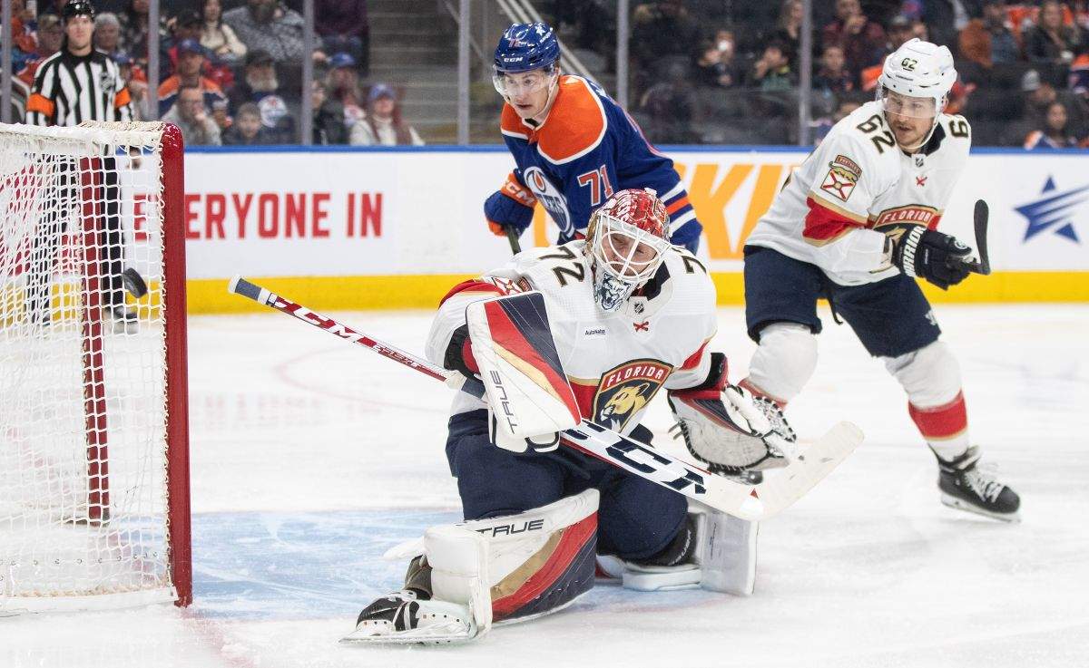 Florida Panthers goalie Sergei Bobrovsky (72) makes the save as Edmonton Oilers' Ryan McLeod (71) and Brandon Montour (62) look for the rebound during second period NHL action in Edmonton on Saturday December 16, 2023.
