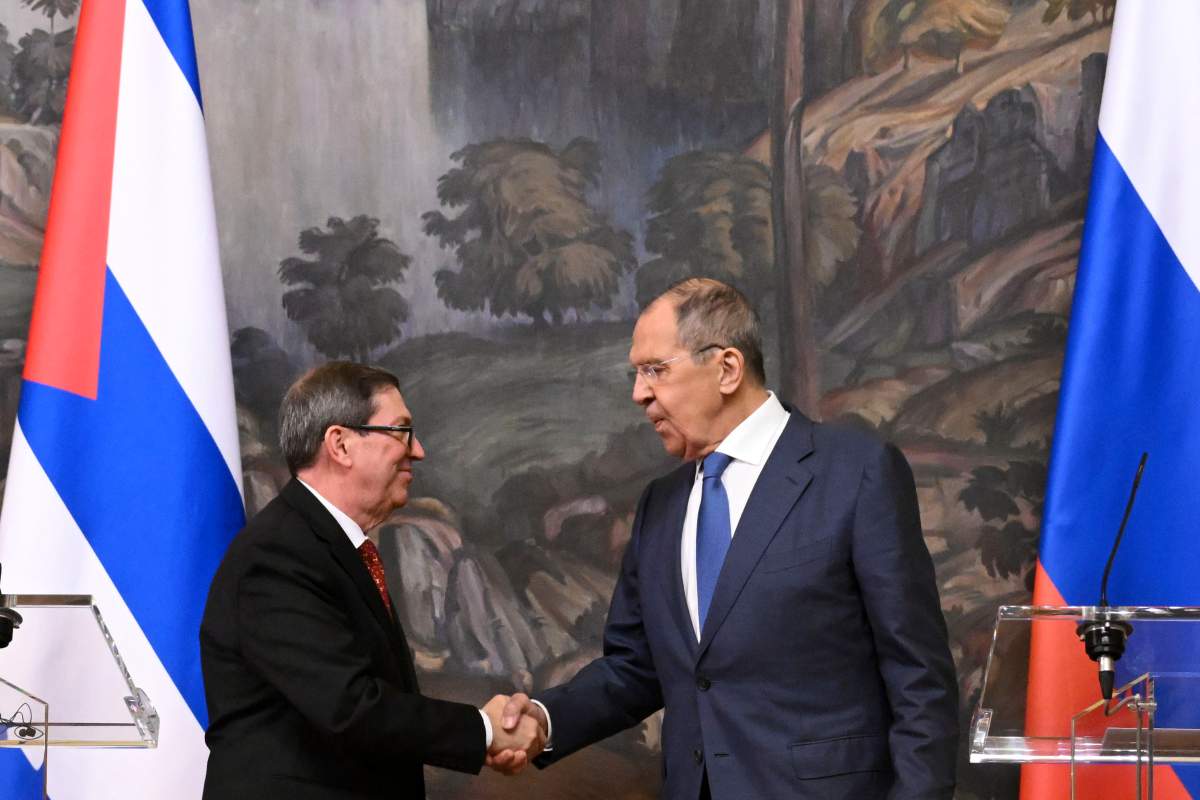 Russian Foreign Minister Sergey Lavrov, right, and his Cuban counterpart Bruno Eduardo Rodríguez Parrilla shake hands after a joint news conference following their talks in Moscow, Russia, Wednesday, June 12, 2024. (Natalia Kolesnikova/Pool Photo via AP)