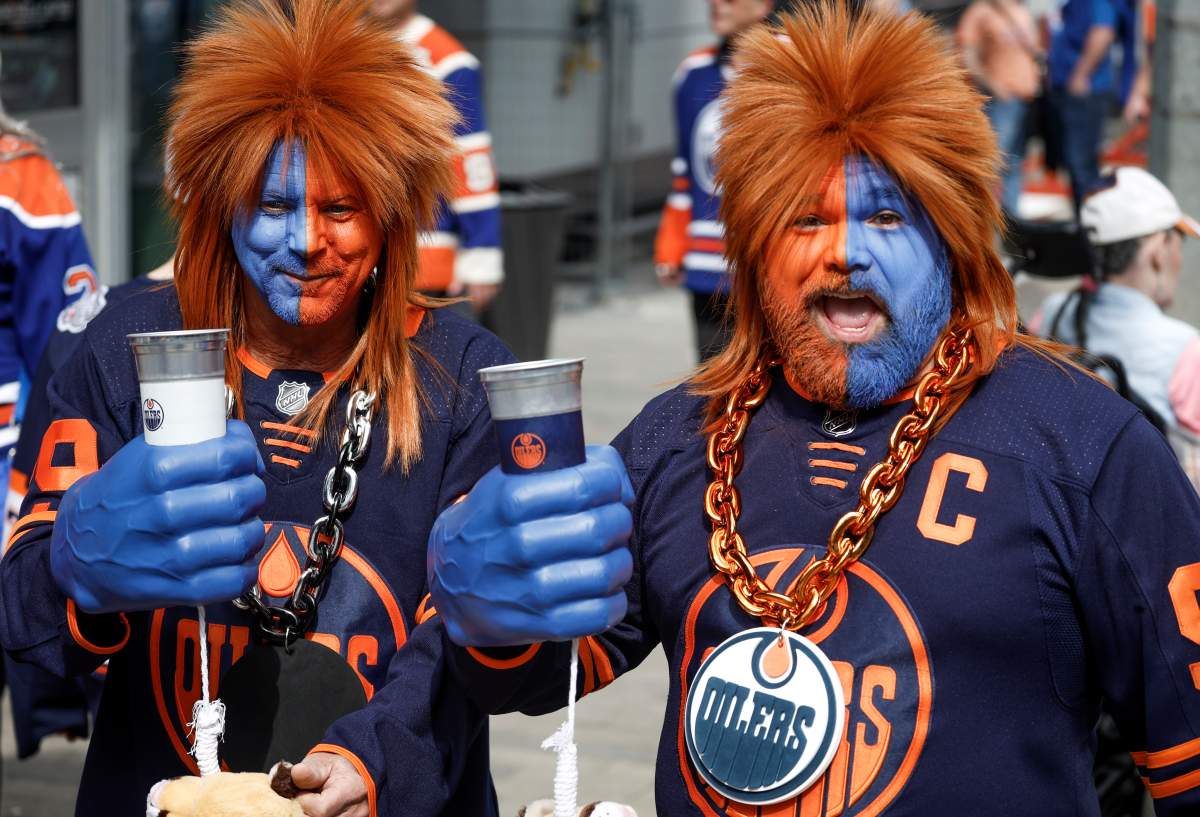 Edmonton Oilers fans Richard Schultz, left, and Brandon Lyle arrive for Game 6 of the NHL hockey Stanley Cup final against the Florida Panthers in Edmonton, Friday, June 21, 2024.