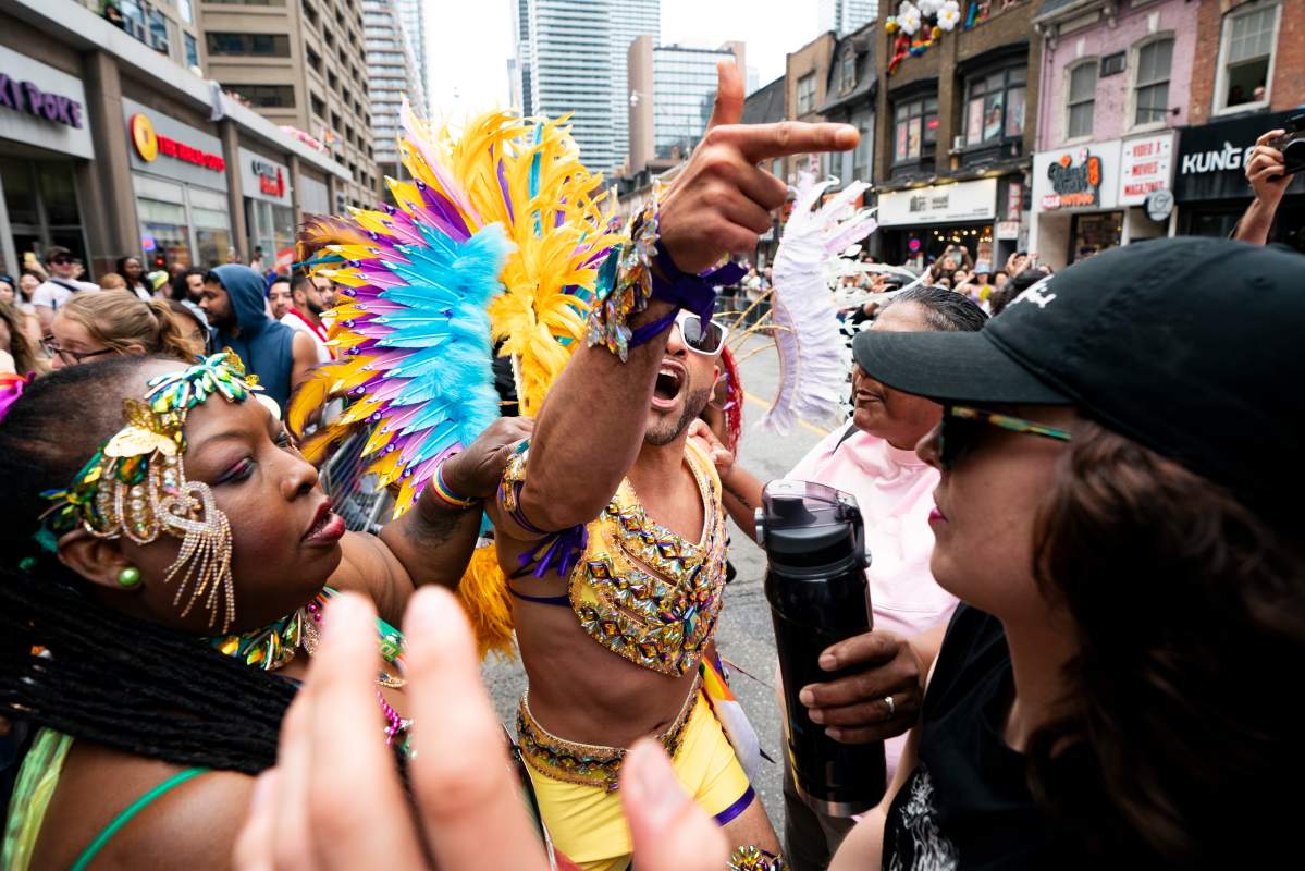 A pride marcher clashes with pro Palestinian protesters as they disrupt the Toronto Pride Parade, on Sunday, June 30, 2024.