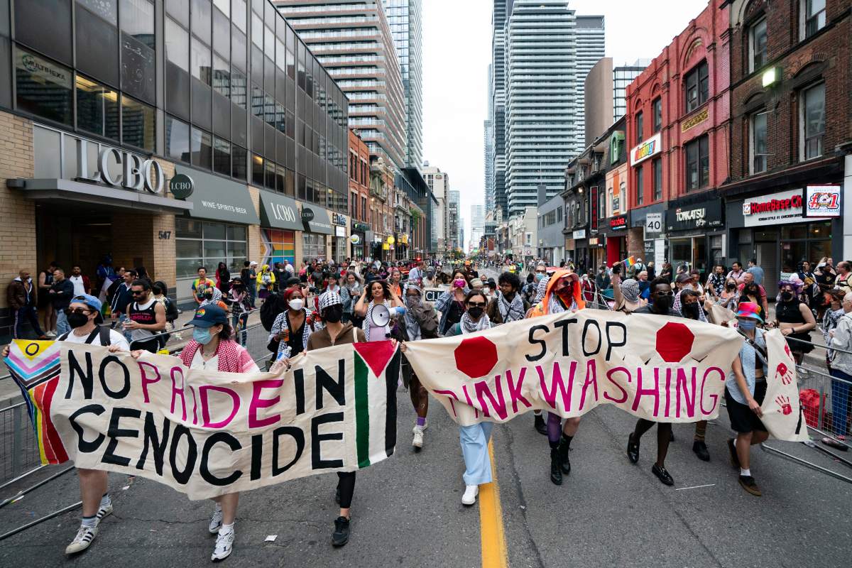 Pro Palestinian protesters disrupt the Toronto Pride Parade, on Sunday, June 30, 2024.