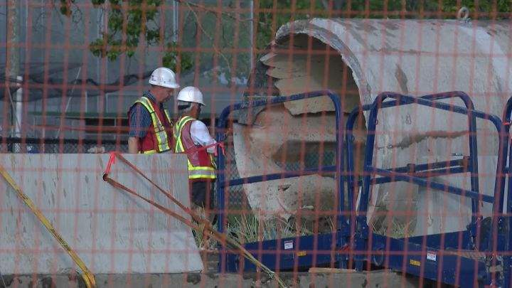 Crews in Calgary work on a water main break on June 10, 2024.