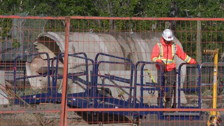Crews in Calgary work on a water main break on June 10, 2024.